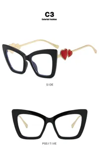 Detailed view of cat-eye blue light blocking glasses with red heart decor