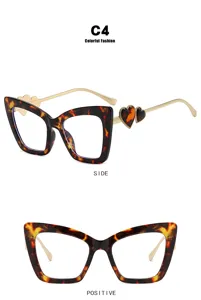 Fashionable tortoise shell cat-eye blue light glasses featuring heart-shaped temple details