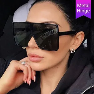 Oversized retro square sunglasses for women featuring a trendy black frame and metal hinge