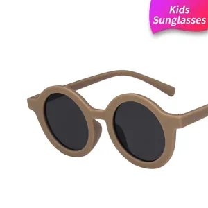 Fashionable round children's sunglasses featuring khaki frames and protective dark lenses