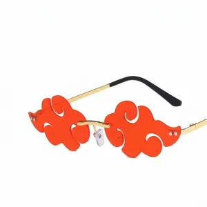 Gafas de sol sin montura en forma de nube con lentes naranjas y patillas doradas retro