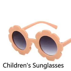 Cute flower-shaped children's sunglasses with UV protection in peach color finish