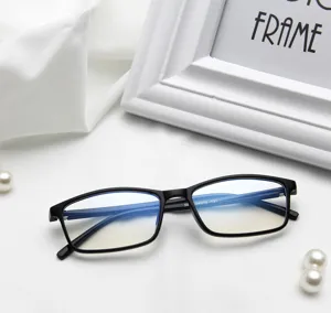 Close-up of matte black glasses frame with blue light blocking lenses on white fabric.