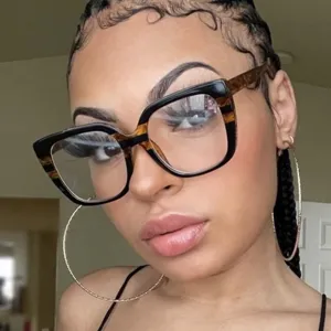 Detailed close-up of oversized square anti-blue light glasses frame on model