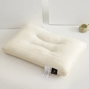Detailed view of white butterfly embroidered Tencel latex ergonomic neck support pillow
