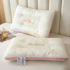 Pair of luxury silk protein pillows with elegant pink piping and embroidered pattern