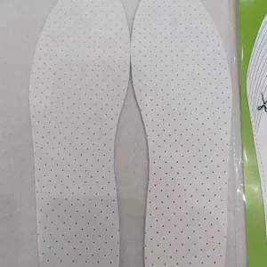 Detailed macro view of breathable white latex insoles featuring multiple ventilation holes