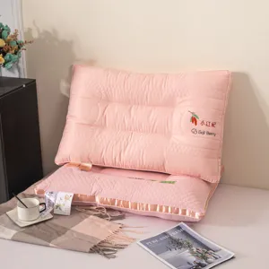 Detail view of pink quilted neck protection pillow core in cozy lifestyle setting