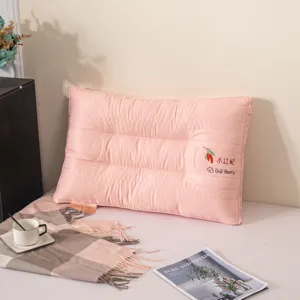 Comfortable pink neck protection pillow 48x74cm shown in a cozy home bedroom setting