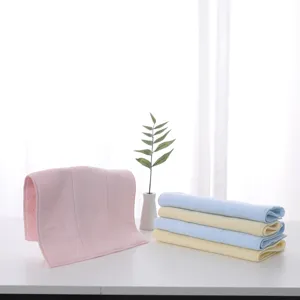 Macro view showing high quality soft latex facial washcloths in pastel pink and blue