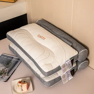 Detailed view of stacked multi-functional neck pillows with grey and white quilted texture