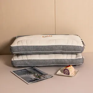 Lifestyle detail of two stacked orthopedic neck pillows with grey textured side mesh