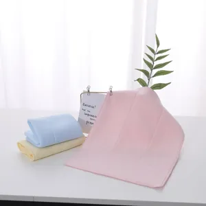 Close-up of soft latex face towel set in pink blue and yellow colors