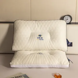 Detailed view of the honeycomb quilted texture on the ergonomic latex neck pillow