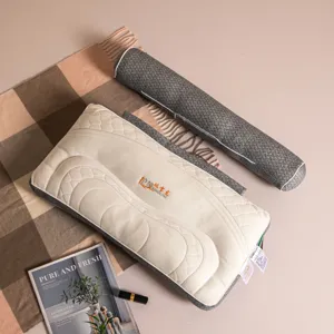 Top view of multifunctional detachable neck pillow with quilted pattern on beige surface