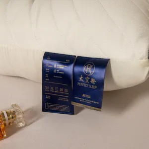Detailed macro view showing the material and care labels on a premium latex pillow core