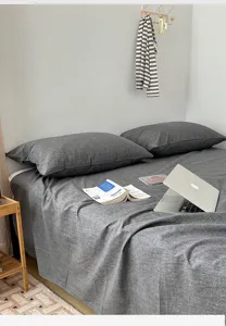Detailed view of dark grey A-grade washed cotton bedding set in a cozy bedroom