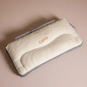 Ergonomic neck protection pillow with quilted wave pattern and detachable layer