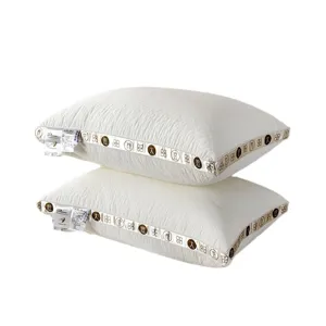 Set of two white quilted soy fiber pillows designed for comfortable neck support and home use.