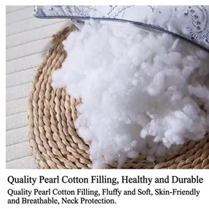 Detailed view of high-quality fluffy white pearl cotton filling for hotel bed pillows