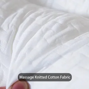 Close-up of breathable white massage knitted cotton fabric for luxury SPA pillows