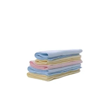 Soft and absorbent multi-colored latex face towels stacked on a white background