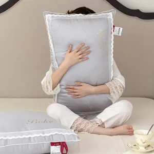 Elegant breathable cotton pillow with white lace trim and gold embroidery