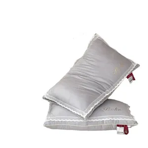 Silver grey breathable bedroom pillow featuring elegant white lace trim and embroidery
