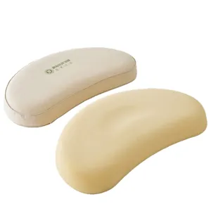 Ergonomic crescent-shaped children's pillow with breathable cotton linen cover and silicone core.