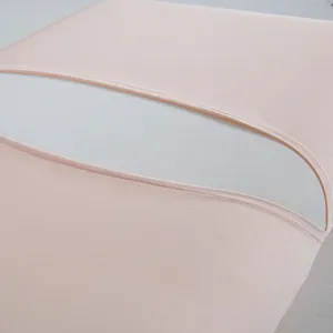 Detail view of a premium light pink cooling ice silk pillowcase featuring fine stitching