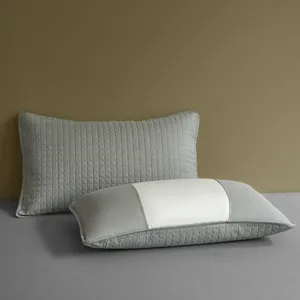 Durable quilted grey and white pillow protector covers for sweat and oil protection