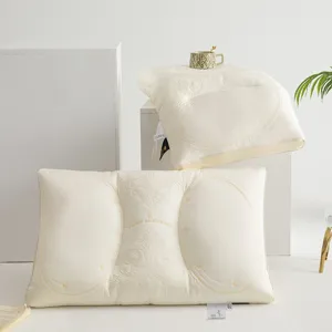 Detailed view of white Tencel latex pillow with ornate embroidery for neck support