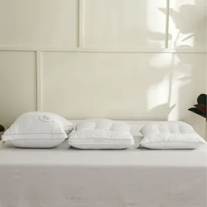 Ergonomic quilted white cotton pillows in three heights for cervical neck support