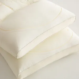 Detailed close-up view of a premium Tencel latex pillow with intricate embroidery
