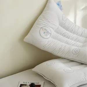 Premium quilted white cotton pillow with ergonomic cervical support design