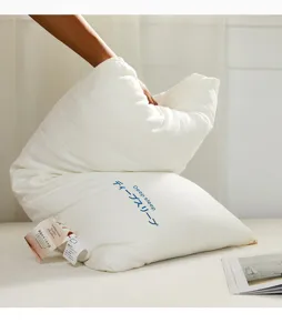 Detail showing the soft compression and resilience of the Japanese cotton pillow.