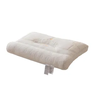 Oreiller ergonomique en Lyocell Tencel blanc avec soutien cervical et motif matelassé.
