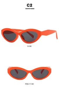 Oranje cat-eye zonnebril met ovaal montuur, zij- en vooraanzicht in detail
