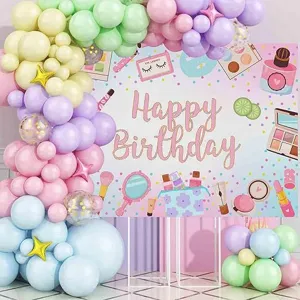 Makeup themed birthday party backdrop with pastel balloon arch for girl birthday