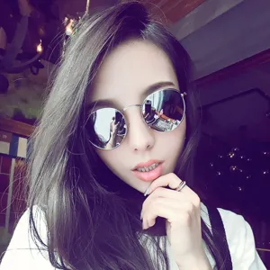 Retro round metal sunglasses with silver reflective lenses for daily UV protection