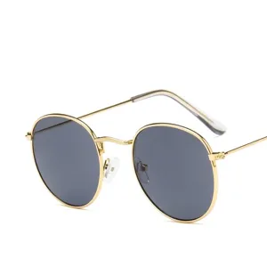 Retro gold metal frame round sunglasses with dark lenses for fashion and UV protection