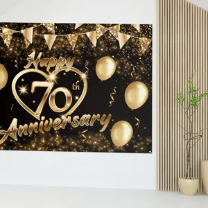 Elegant black and gold 70th anniversary backdrop with golden balloons for party decoration
