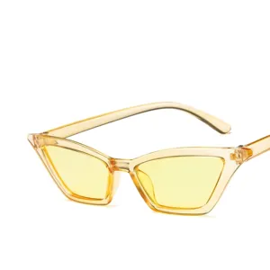 Trendy small cat-eye sunglasses with yellow transparent lenses for retro fashion.