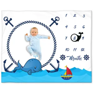 Nautical baby milestone blanket with monthly numbers and whale print for photography