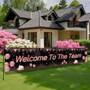 Black and pink Welcome To The Team banner with balloons for outdoor celebration decor.