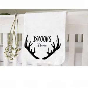Personalized forest hunting style baby milestone blanket with antler print and Brooks name