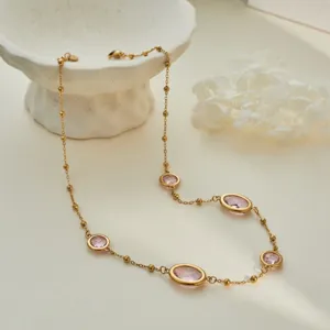 Close-up of pink gemstone bead chain necklace with gold-plated stainless steel bezel