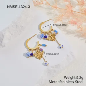 Detail view of gold-tone bee and flower charm hoop earrings with dimensions and weight