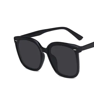 Fashionable oversized black sunglasses with silver rivet details and UV400 protection