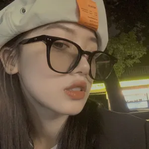 Stylish retro black small frame anti-blue light glasses worn by model outdoors